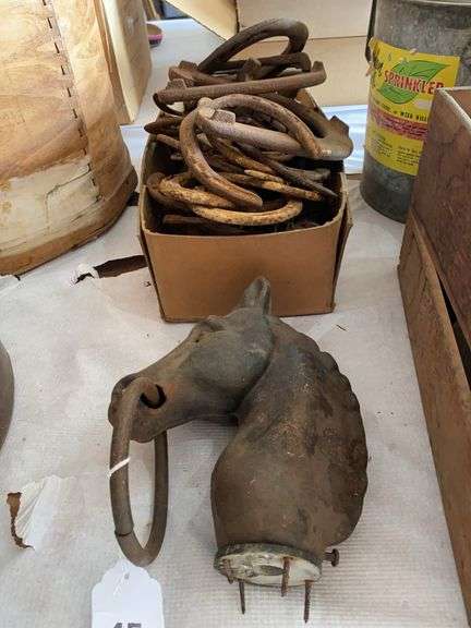 Cast iron horse head for hitching post, horse shoes image