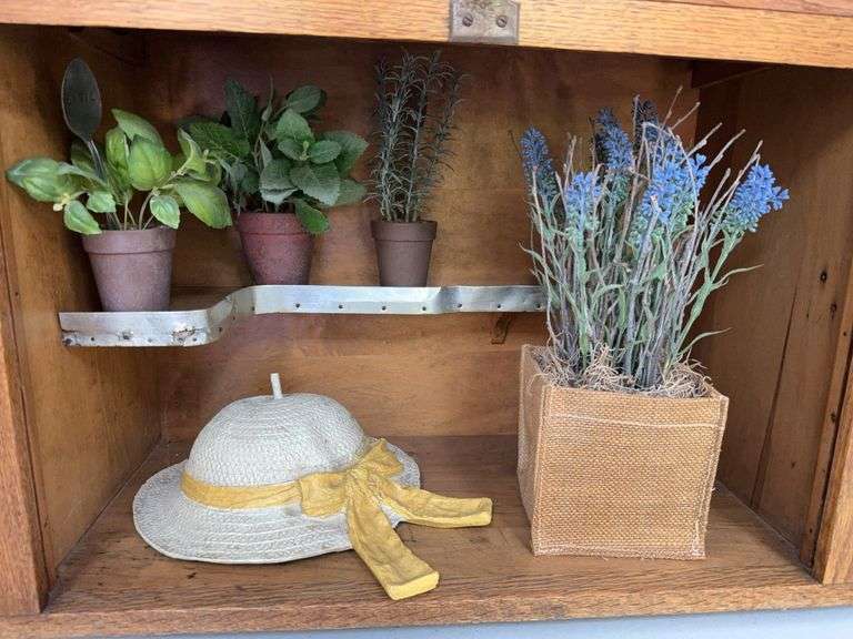 Artificial floral items, book, resin sun hat, cross image