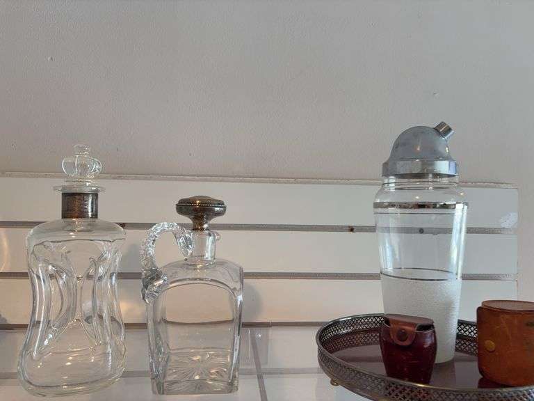 Liquor bottles, shaker , tray, leather sleeved shot glasses image