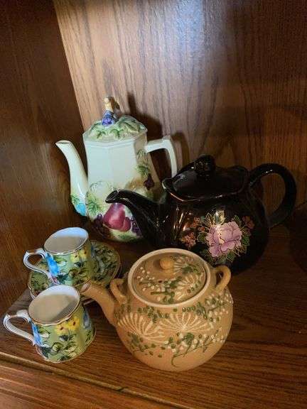 3 teapots, 2 miniature cups and saucers image