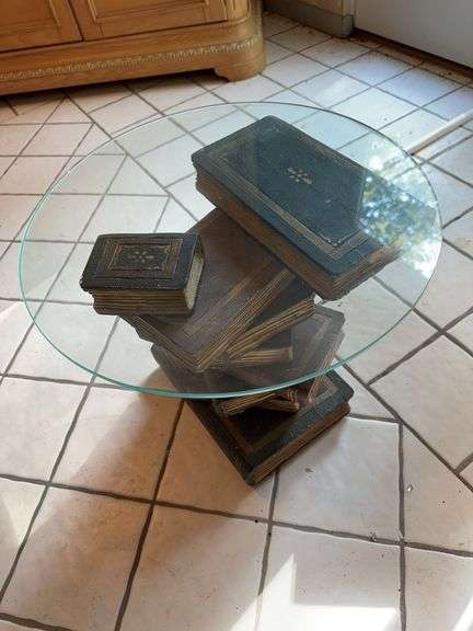 Glass top side table with decorative book base image