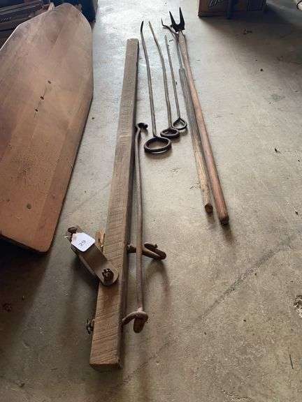 Antique scale or whippletree as part of a ox harness, cast iron hook, poker and fork image