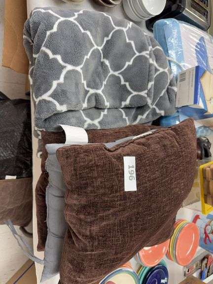 Blankets, pillows, heating pad, padded seat, baskets, misc image