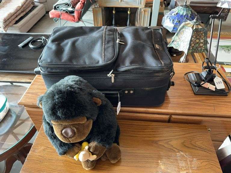 Suit case, Stuffed Monkey, Cabbage Patch doll, misc image