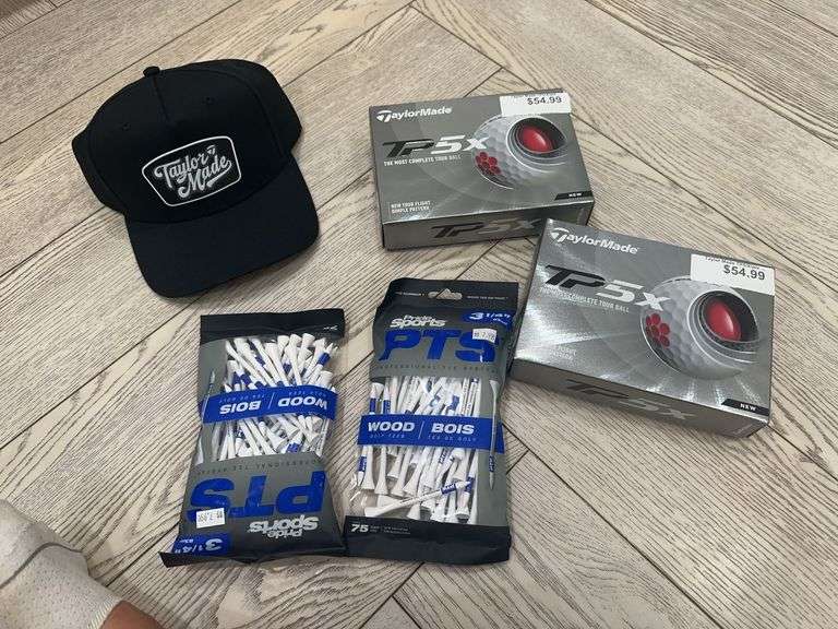Taylor Made hat, 2 boxes of Taylor Made TP5x gold balls, 2 bags of Sports Pride golf tees image