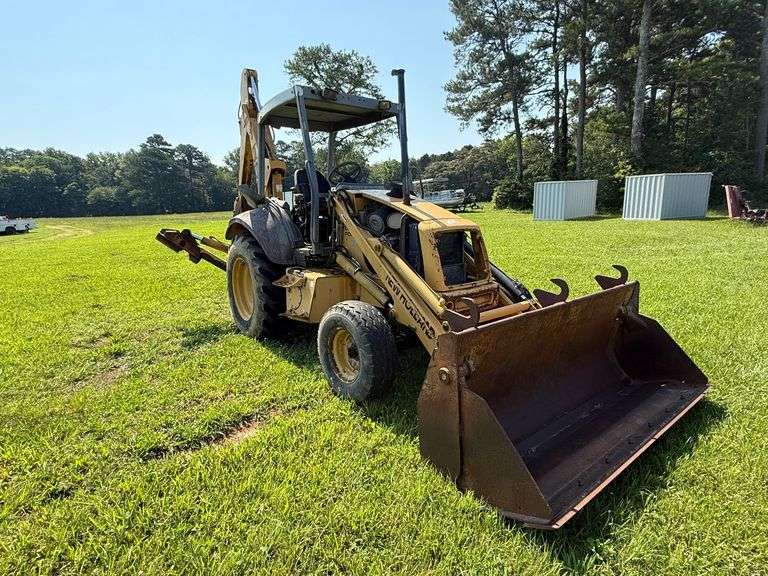 New Holland 655E Backhoe - Clamshell bucket - Walker Co Water & Sewerage Surplus