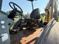 New Holland 655E Backhoe - Clamshell bucket - Walker Co Water & Sewerage Surplus