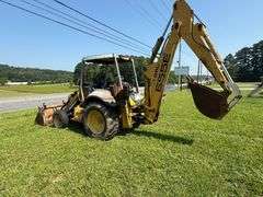 New Holland 655E Backhoe - Clamshell bucket - Walker Co Water & Sewerage Surplus