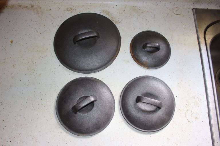 (3) Various Sized Cast Iron Sauce Pans, Strainers, Square Cast Iron Skillet, Cast Iron Baking Pans, Cookie Rack, Muffin Pan, and Decorative Frying Pan