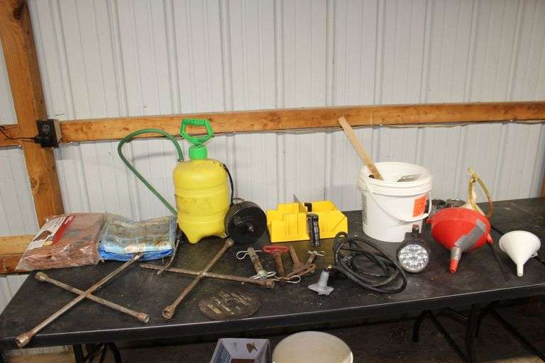 2 Gallon Sprayer, Metal Fuel Can, (2) 4 Way Tire Tools, Miter Box, Pins, Sewer Snack, Hand Saw, (2) 8 Ft. x 10 Ft. Tarps, 8 In. Circular Saw Blade, Funnels, and Misc. image