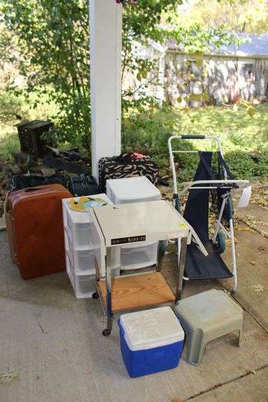 Metal Cart, Suitcases, Luggage Bag, Coleman Cooler, Hamper Cart, (2) 3-Drawer Plastic Containers, and Footstool image