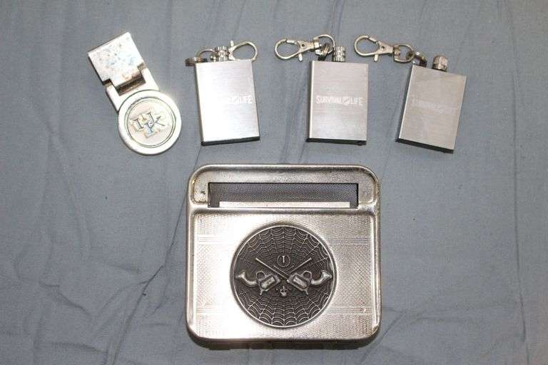 Metal Cigarette Roller, (3) Survival Life Keychain Fire Starters, and UK Money Clip image