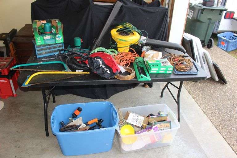 Jumper Cables, Hand Saws, Water Hose, Hanging Work Light, Weed Eater Power Blower, Bolt Bin, Water Hose Attachments, Sprinkler, Water Seal Tape, Window Install Kit, and Misc. image