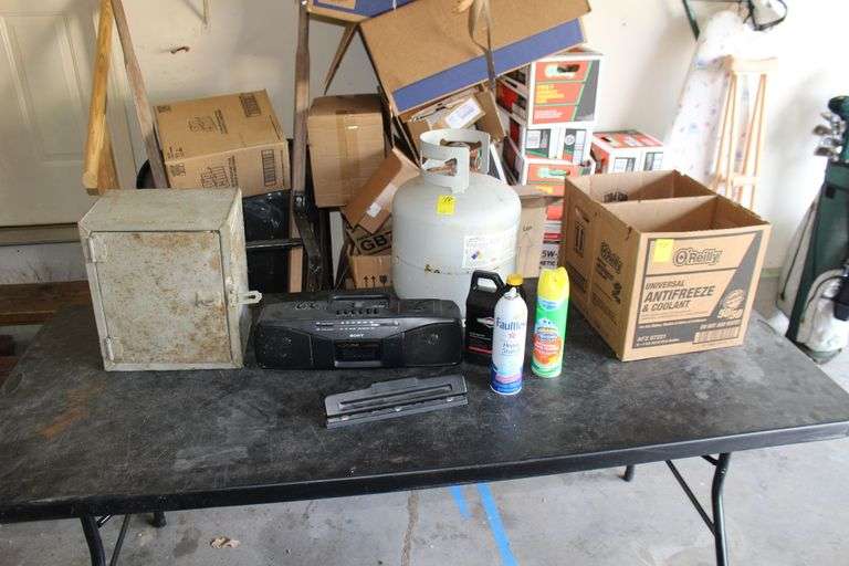 Single Door Metal Safe, 3 Hole Punch, Sony Radio, Propane Tank, SAE Small Engine Oil, Faulet Starch, and Scrubbing Bubbles image