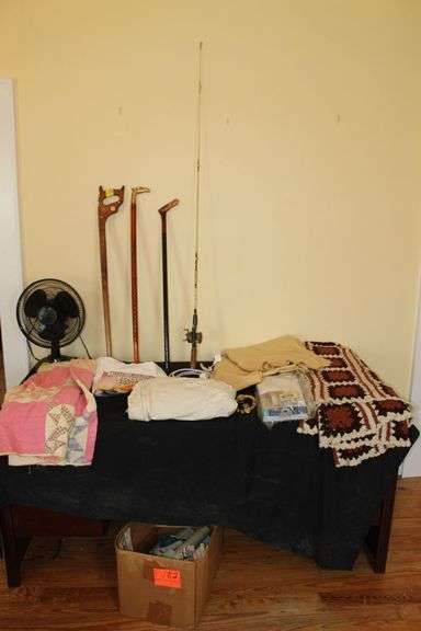 (3) Canes, Afgan, Quilt, Window Blinds, Blanket, Comfort Zone Fan, Extension Cord, Fishing Rod and Reel, and Battleship Wisconsin Large T Shirt image