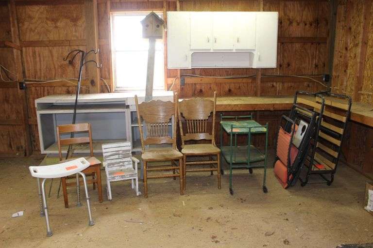 Folding Cot, Lawn Chair, Metal Cart, (2) Dining Room Chairs, Small Rocking Chair, Shower Seat, Wooden Chair, Bird House, Card Table, and (2) Shepherds Hooks image