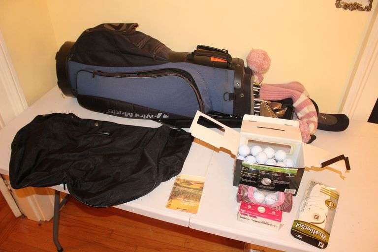 Taylor Made Driver, Cleveland Irons, Taylor Made Bag, Wilson and Nitro Golf Balls, and Women's Large Golfing Glove image