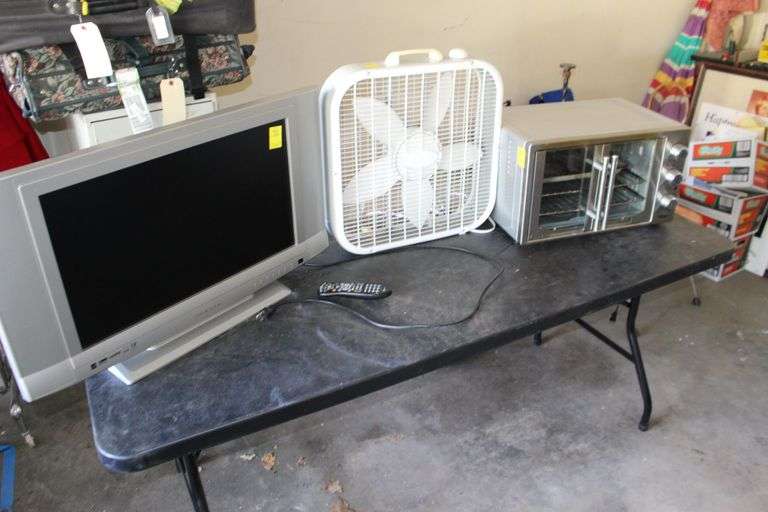 27 Inch Olevia TV, Lasko Fan, and Oster Toaster Oven image