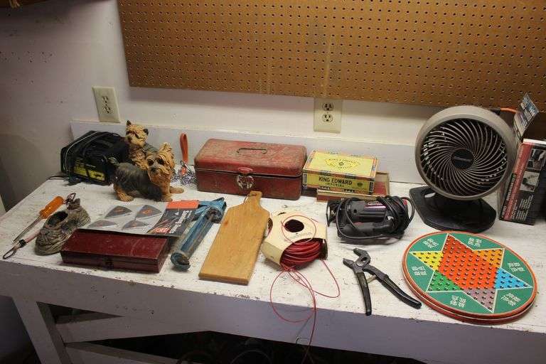 Fan, Battery Charger, Spiral Saw, Caulk Gun, Cutting Board, Chinese Checkers Game Board, String, Ceramic Dog Figurines, and Misc. image
