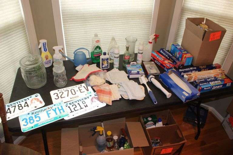 Cleaning Supplies, Dish Clothes, Dusters, Reynolds Wrap, Wax Paper, Zip Lock Bags, Glass Peanut Jar, License Plates, and Misc. image