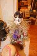 Jeanie Rub Massager, Electric Iron, Porcelain Dolls, Decorative Plates, Candy Dish, Figurines, Kewpie Doll, and Misc.