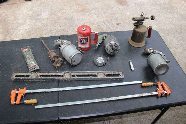 (2) Bar Clamps, Level, Craftsman, DeVilbiss, Black Paint Sprayer, Torch, 50 Ft. Lufkin Tape Measure, T Bevel, and Sure Shot Sprayer image