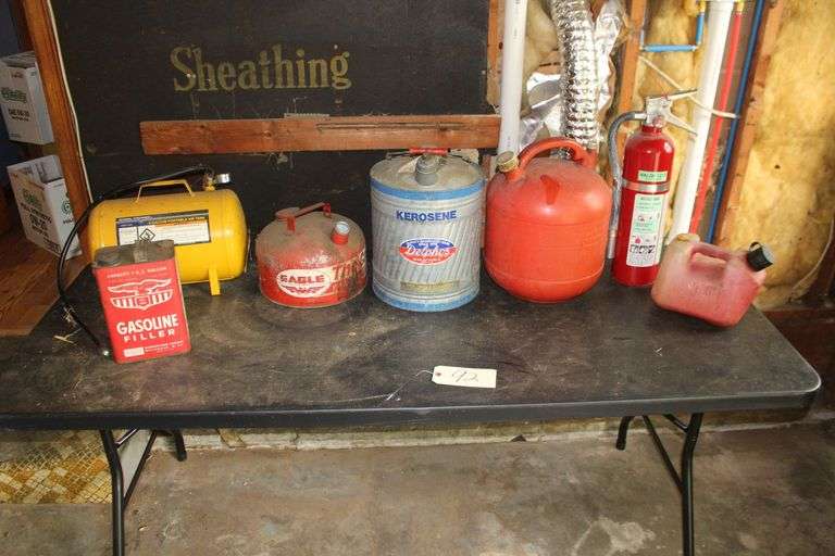 Metal Kerosene Fuel Can, Metal Gas Can, (2) Plastic Gas Cans, Fire Extinguisher, and Central Pneumatic 5 Gallon Portable Air Tank image