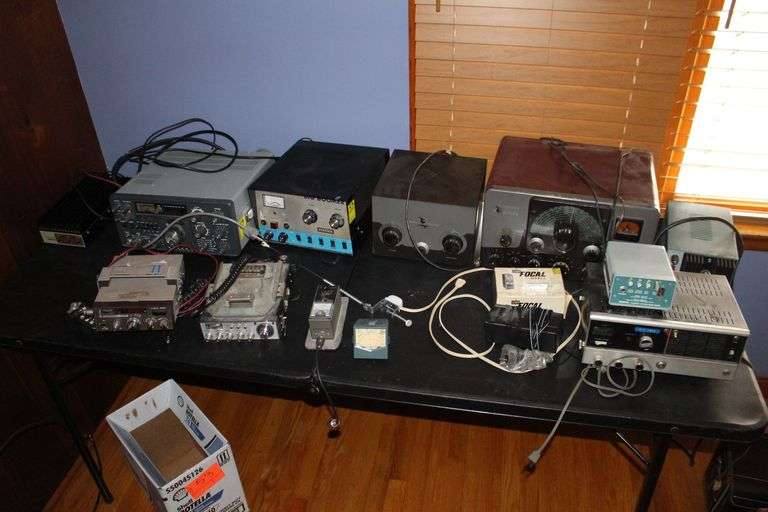 Yaesu FT-101Z0 Transceiver, Big Boomer Kris Amplifier, Johnson Viking Matchbox Antenna Tuner, Johnson Viking Ranger Radio Transceiver, Lafayette Comstat 25B, Cobra 25 CB Radio, Midland CB Radio, and Misc. image