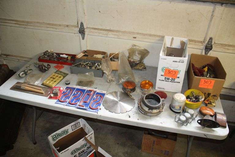 Car Fuses, Various Sized Nuts and Bolts, Caution Lights, Storage Hooks, 10 Inch Circular Saw Blade, and Misc image