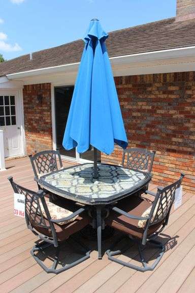 Patio Table, (4) Cushioned Chairs, and Umbrella image