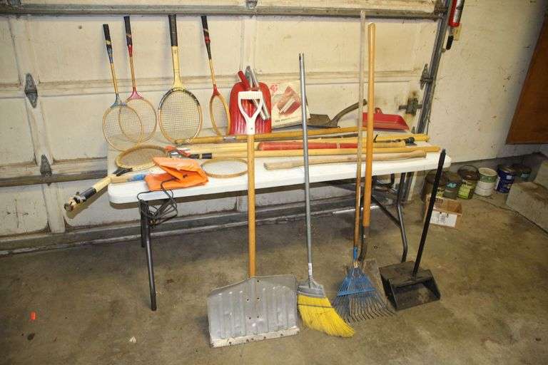 Scoop Shovel, Broom, Shovels, Handles, Hook with Handle, Pry Bars, Dust Pans, Rake, (6) Rackets, Folding Shovel, Battery Warmer, and Tactical Knife with Sheath image
