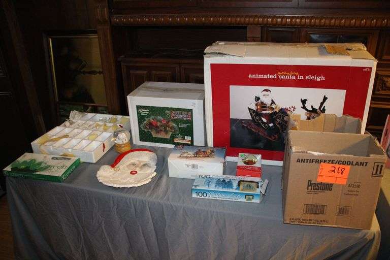 Holiday Living Animated Santa in Sleigh, 18 Inch Christmas Centerpiece, Angel Ornaments, Santa Serving Plate, Christmas Lights, Food Network Christmas Bowls and Plates, and Carole Towne Village Volunteers Figurines image