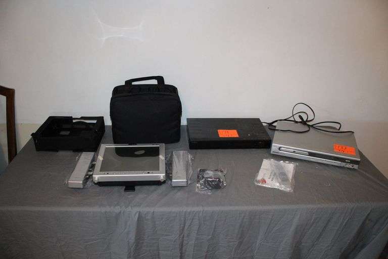 Insignia Bluray Player, Medion DVD Player, Audiovox TV with Speakers, Case, and Bag image