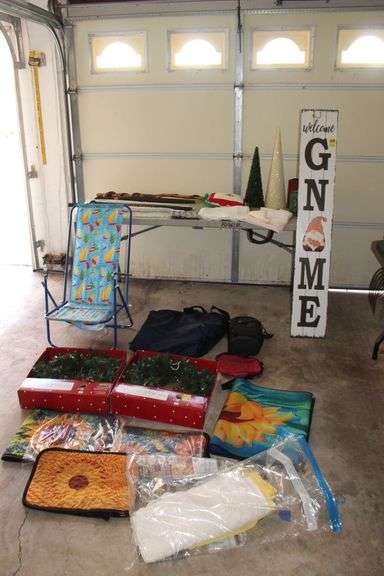 (2) 24 in LED Wreathes, Wooden Walking Stick, Beach Chair, Table Cloths, Place Mats, Luggage Bag, (4) Umbrellas, Colgan's Taffy Tolu Tin, and Misc image