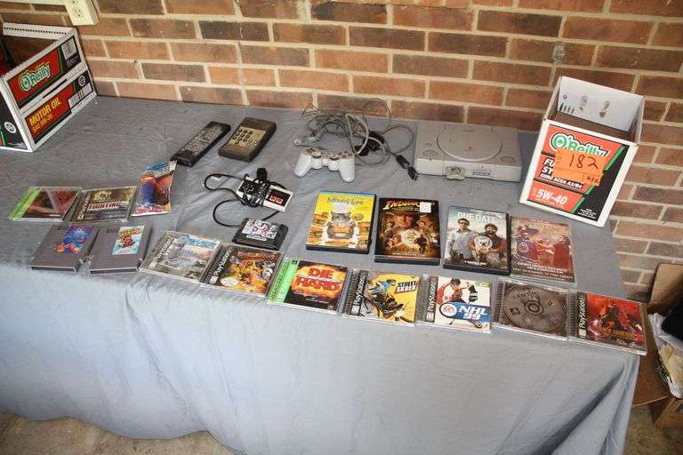 Playstation Console and Controller, Playstation Games, Super Mario 2 and Tetris Nintendo Games, University of Kentucky Pez Dispenser, Nintendo Controller, and DVD Movies image
