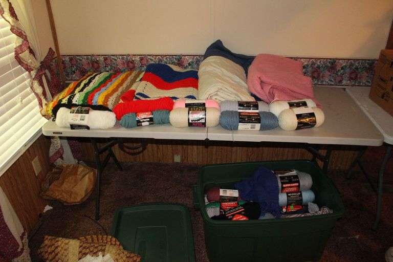 Various Colored Yarn, Afghans, and Blankets image