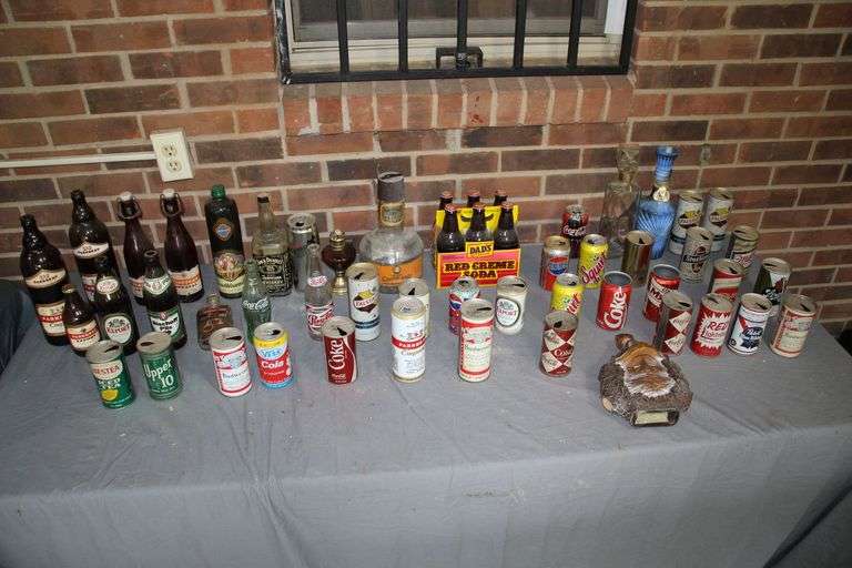 Decanters, Soda Cans, Glass Liquor Bottles, Dads Old Fashioned Cream Soda Bottles, Oil Lamp Base, and Glass Soda Bottles image