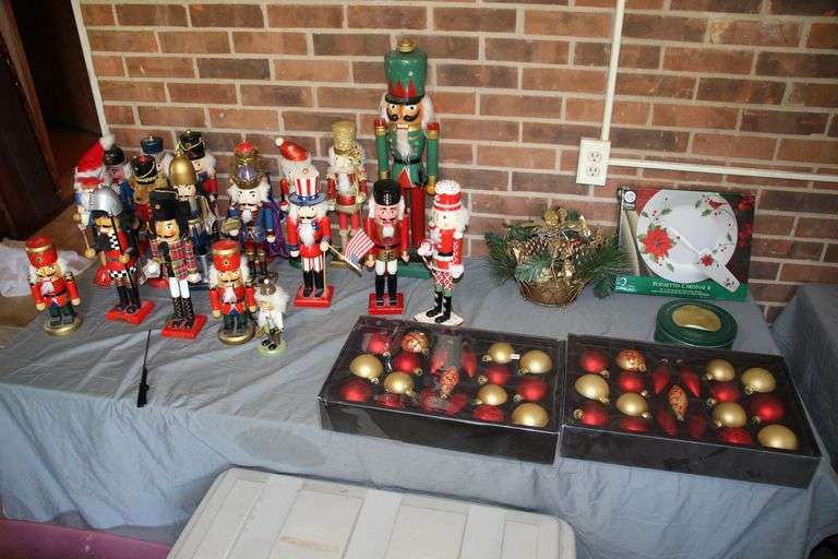 Various Sized Nut Crackers, Ornaments, Cake Plate and Server, Decorative Basket, and Misc Christmas Decorations image