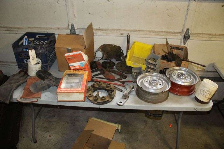Welding Gloves, (2) 11 Inch Rims, Fan Blades, Exhaust Manifolds, Nails, Screws, Reese Hitch, Plastic Nuts and Bolts Containers, Volt Meter, and Misc image
