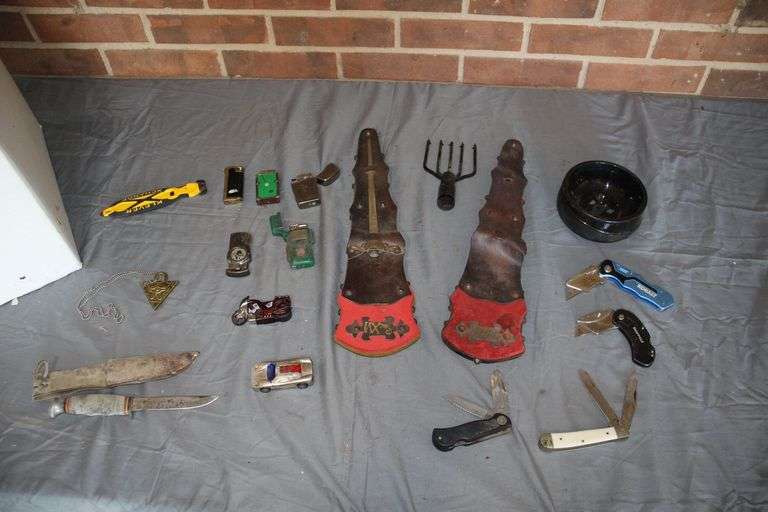 Lighters, Fish Gig Head, Pocket Knives, Ash Tray, Kabar Fixed Blade Knife with Sheath, and (2) Knife Sheath Decorations image
