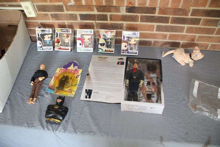 12 Inch General Custer Action Figure, Funko Pops, Conehead Action Figure, Stuffed Mr. Bigglesworth Cat, 1997 Kenner Doll, and Batman Coin Bank image