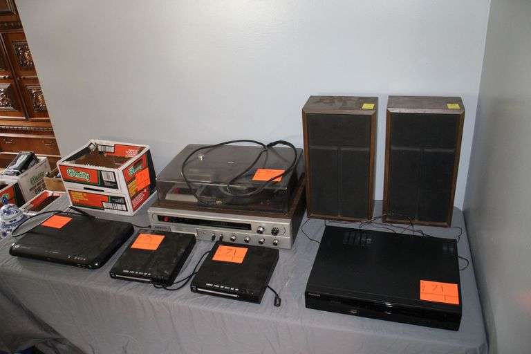 Electro Brand Turntable, (2) Speakers, (2) Allvol Blu-Ray Players, Samsung VHS/DVD Player, Sabre DVD Player, and Misc. Remotes image