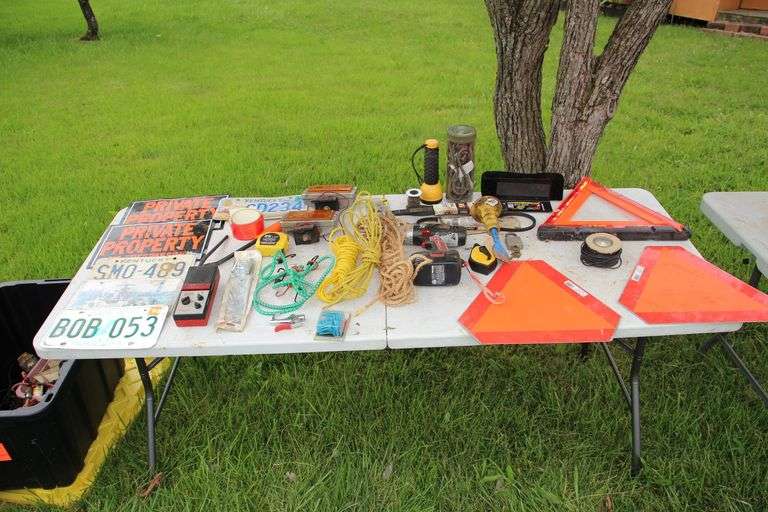 (2) Caution Signs, Folding Caution Sign, Bungee Cords, Chisels, RoadHelper Radio, Rope, 19.2 V Craftsman Drill, (2) Caution Lights, License Plates, and Misc image