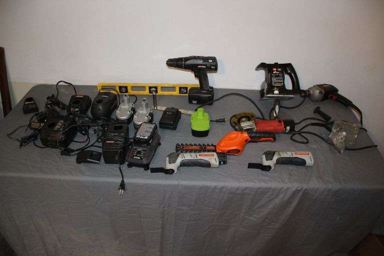 Powertank 18V Batteries, Black and Decker 6 Inch Hedge Trimmer, (2) Craftsman 12V Multi Tools, Wen All Saw, Craftsman Corded Drill, Level, Craftsman 16.8 V Drill, 4.5 Inch Angle Grinder, Craftsman Sander, Misc Batteries, and Battery Charger image