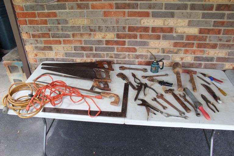 Combination Wrenches, Ball Peen Hammer, Pliers, Oil Can, Pipe Wrenches, Square, (4) Hand Saws, Electrical Cords, and Misc. image