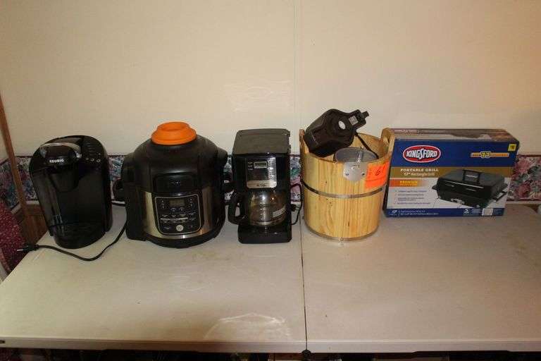 Oster Ice Cream Maker, Ninja Electric Pressure Cooker, Keurig Coffee Pot, Kingsford 17 In Portable Grill, and Mr. Coffee Coffee Maker image