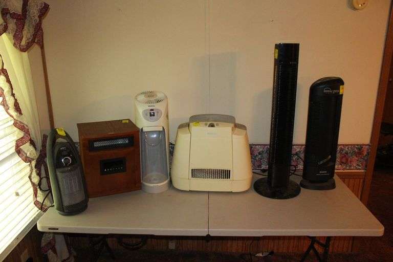 Trotanonics Fan, Envision Air Purifier, Sunbeam Heater, Arm and Hammer Dehumidifier, Holmes Dehumidifier, and Electric Infrared Heater image