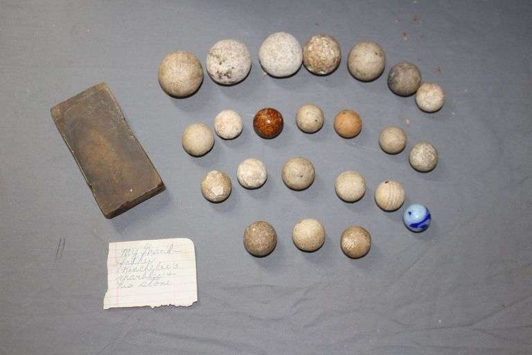 (22) Stone Marbles, (1) Marble, and Wet Stone image
