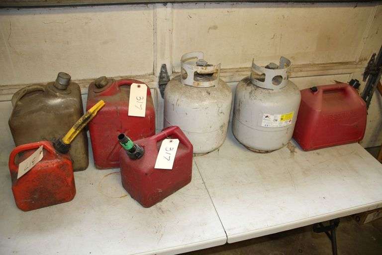 (3) 5 Gallon Fuel Cans, (2) Propane Tanks, 5 Liter Gas Can, and 2 Gallon Gas Can with Contents image
