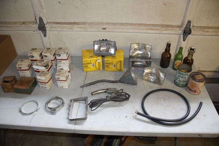 Phillips Westinghouse Headlight, Various Sized Hose Clamps, Glass Bottles, Phillips Westinghouse Headlamps, Funnel, and Misc image